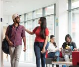 Postgraduate students walking and talking
