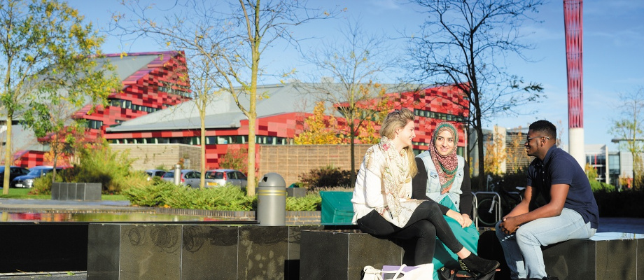 Male and female undergraduate students relaxing, Jubilee Campus
