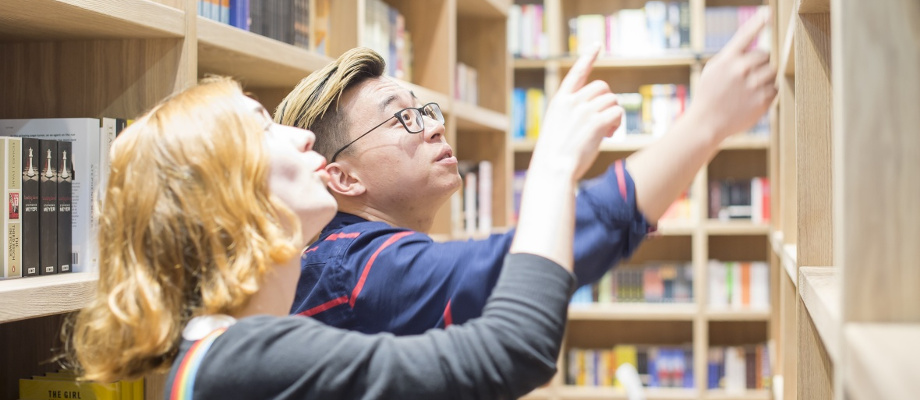 Students looking in the Bookshop situated in the Portland Building, Ningbo Campus