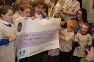 Children from Brookside Primary School with the winner's cheque.